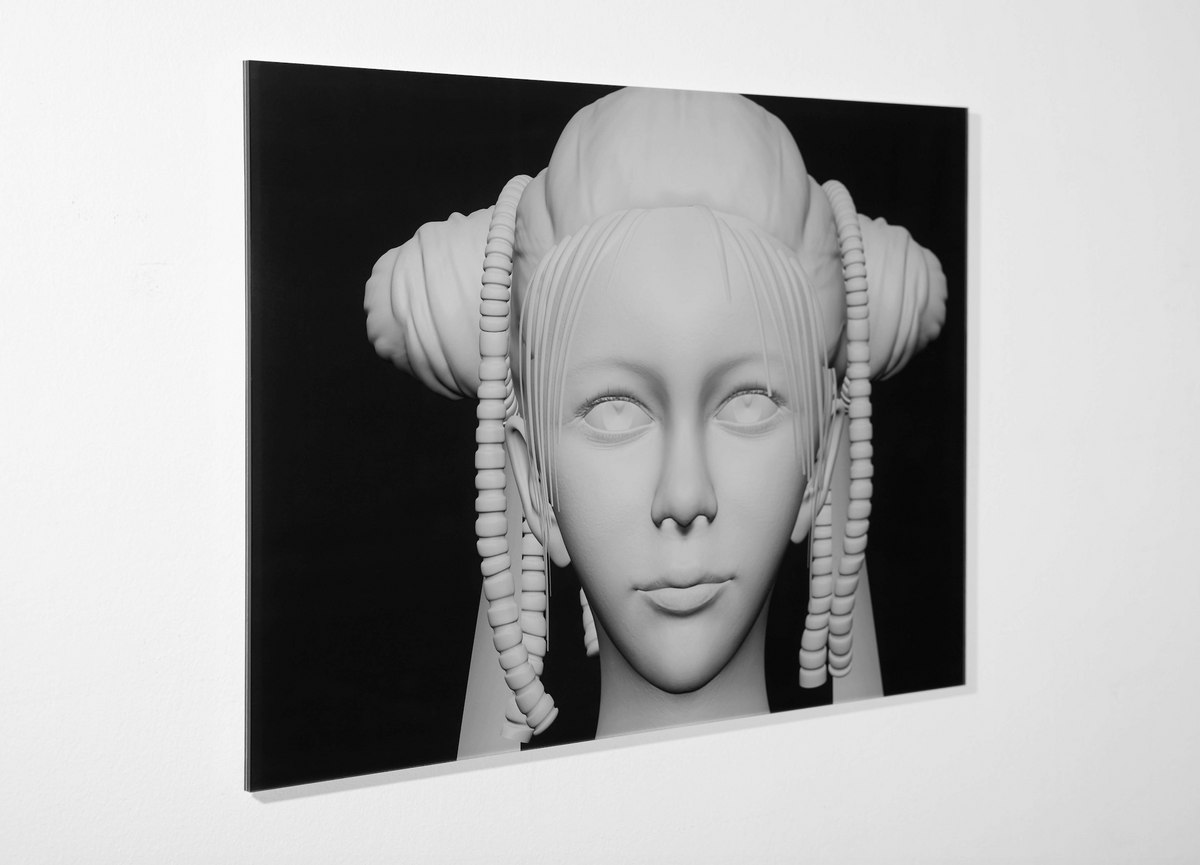 Showing the Artwork by Cao Fei (Chinese 曹斐 ) hanging on the wall. Depicting the so called "New Angel", a computer generated white face of a woman on black background. 